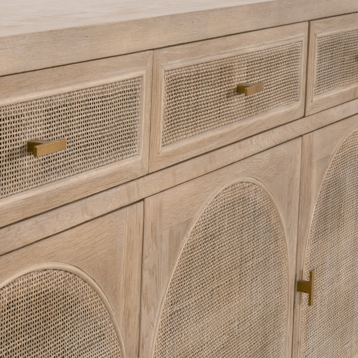 Cane sideboard with brass pulls.