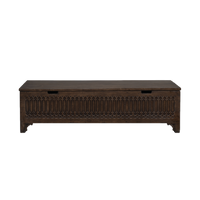 Wooden storage bench with intricate carvings.