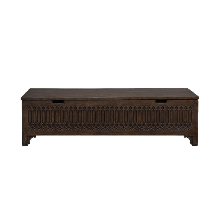 Wooden storage bench with intricate carvings.