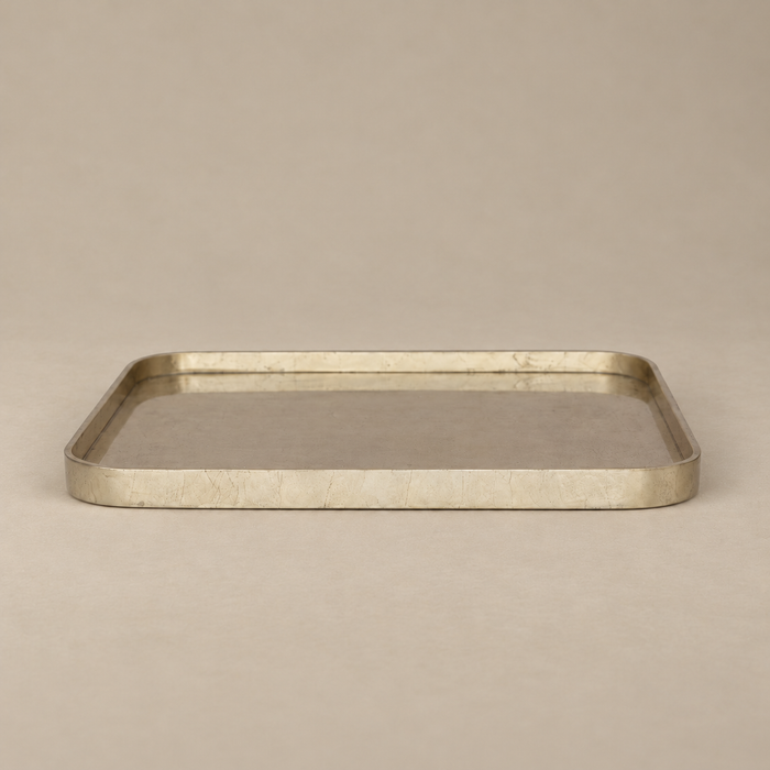 A rectangular metal tray with rounded corners and a brushed metallic finish, shown on a plain beige background.